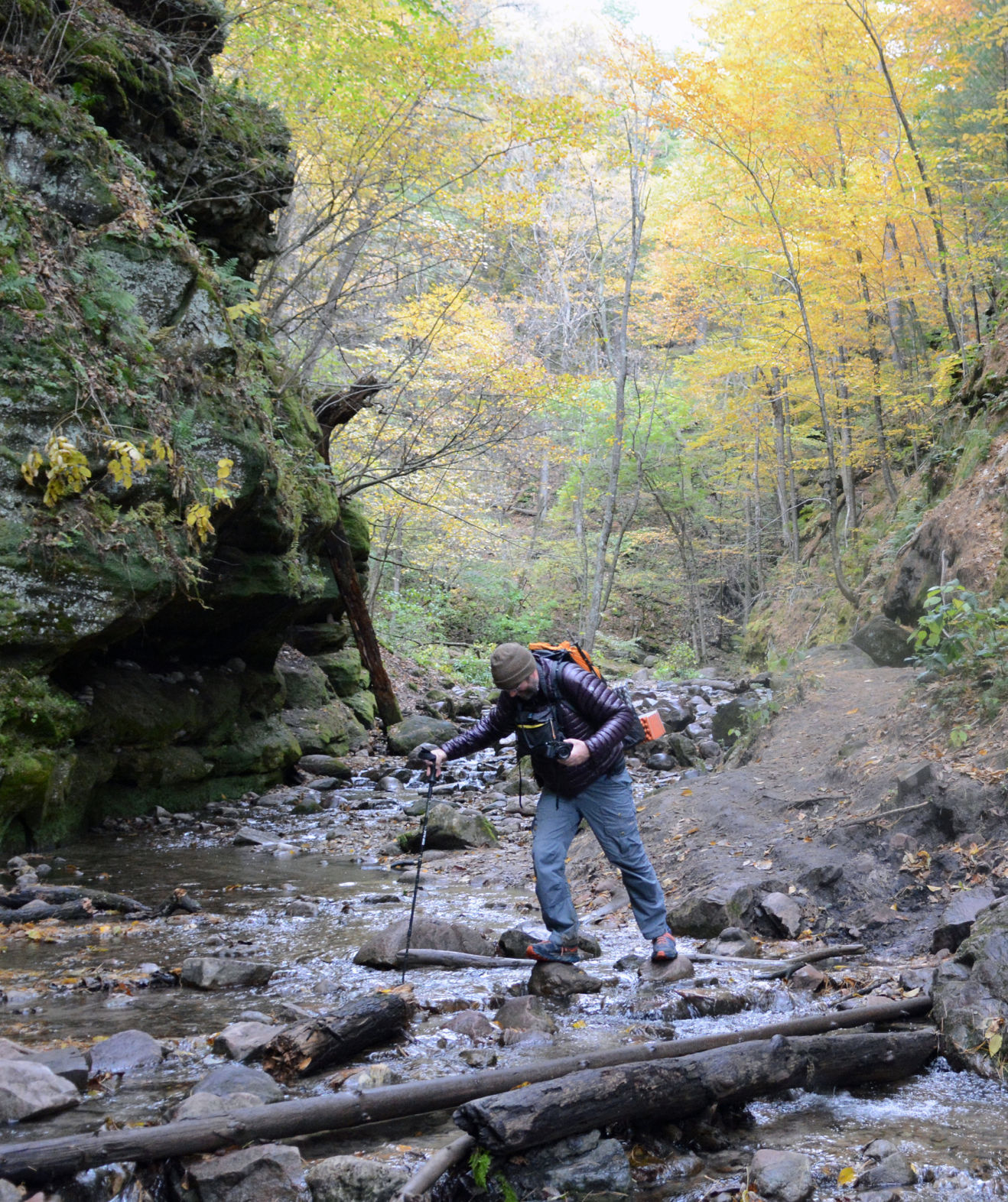 Gillie crossing stream